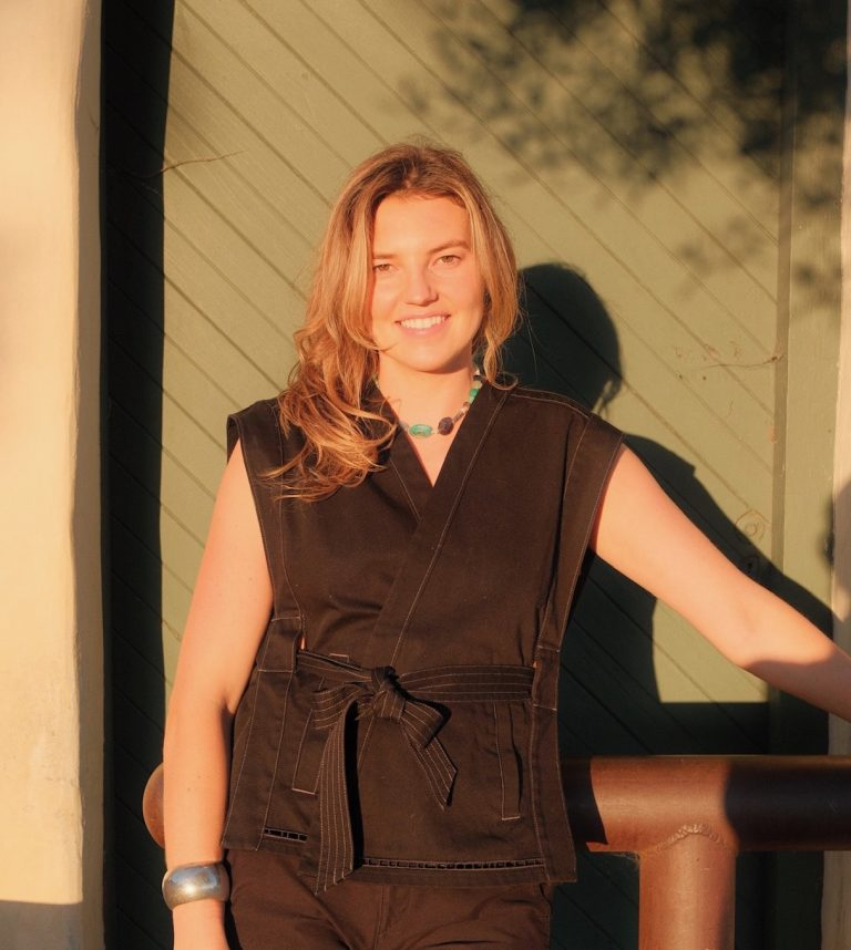 Annabel Lind smiling in golden evening light