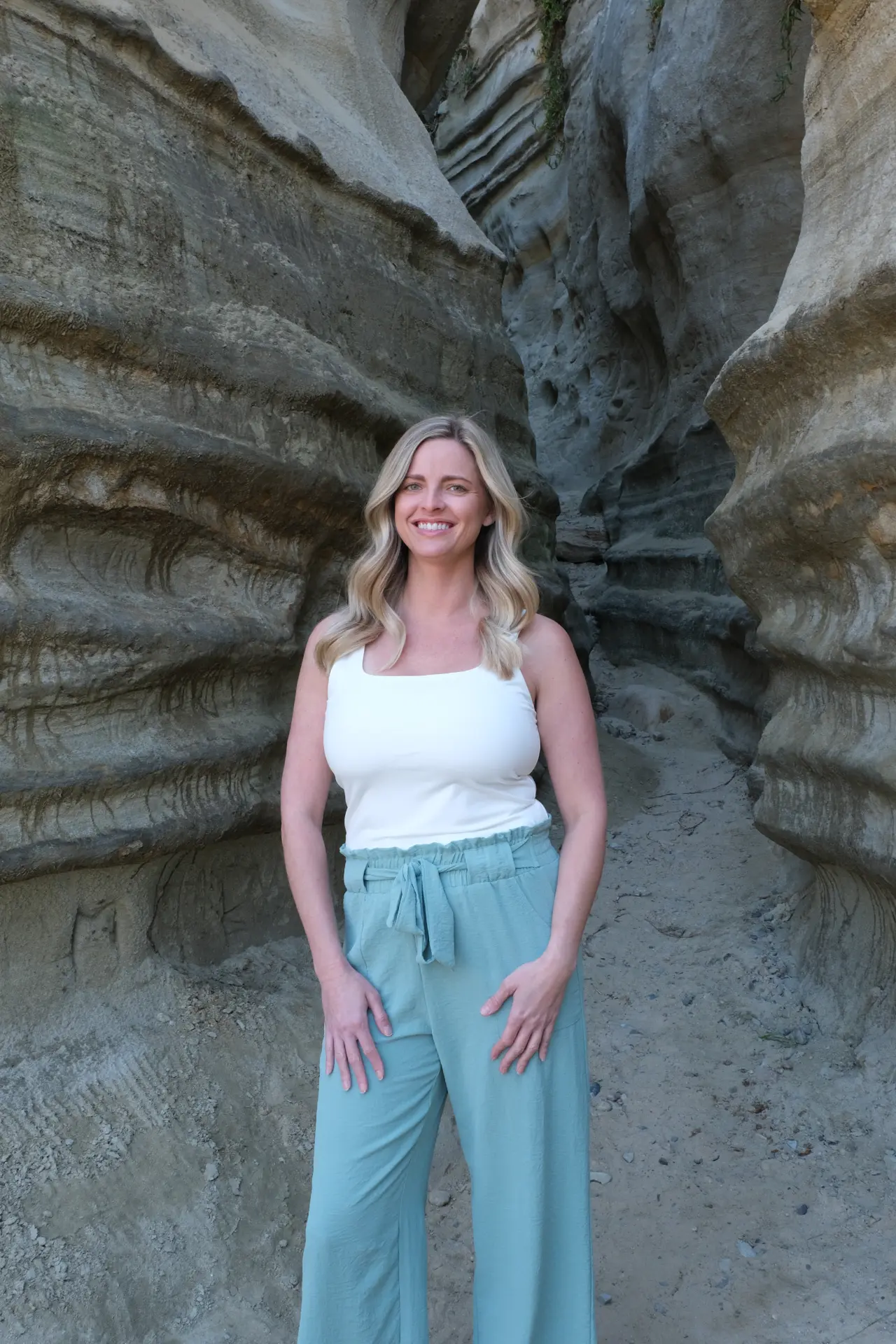 Pamela Armstrong standing inside a slot canyon